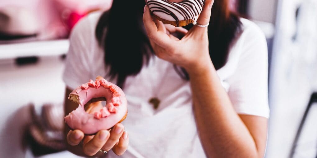 women eating donuts
